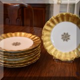 P03. Set of 8 Limoges gold trimmed scalloped plates. 